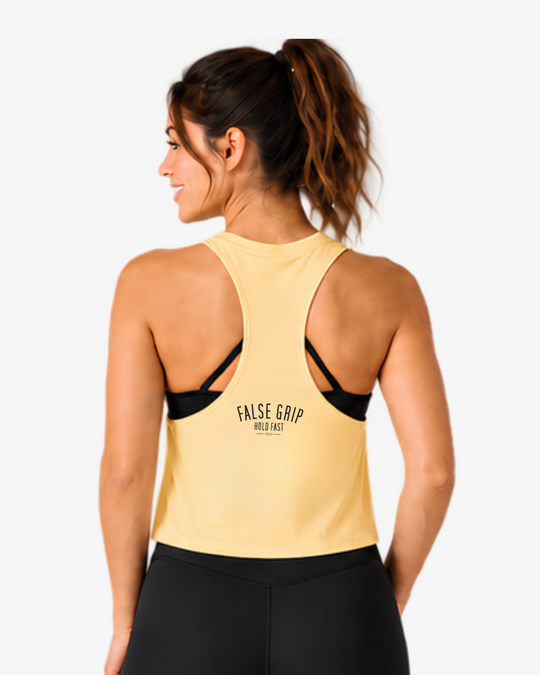 Vista traseira do Crop Tank Burpees &amp; Bad Decisions em Vanilla, com costas racerback e assinatura False Grip.