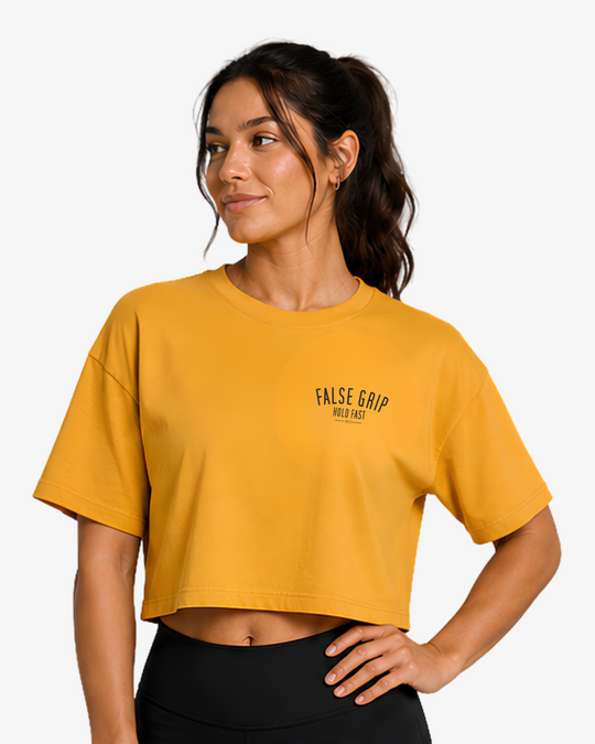 Crop T-Shirt Fueled by Pre-Workout da False Grip em Mustard, corte oversize cropped e logótipo discreto no peito.