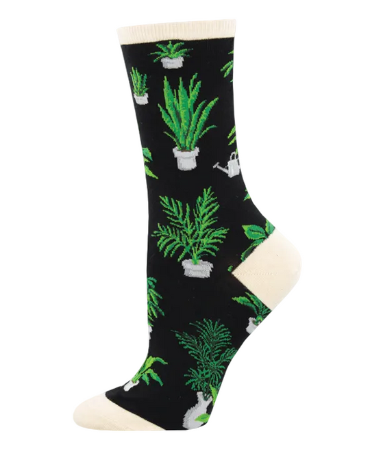 Meias Home Grown - Lifestyle da Socksmith em preto, com padrão de plantas em vasos e pequenos regadores.